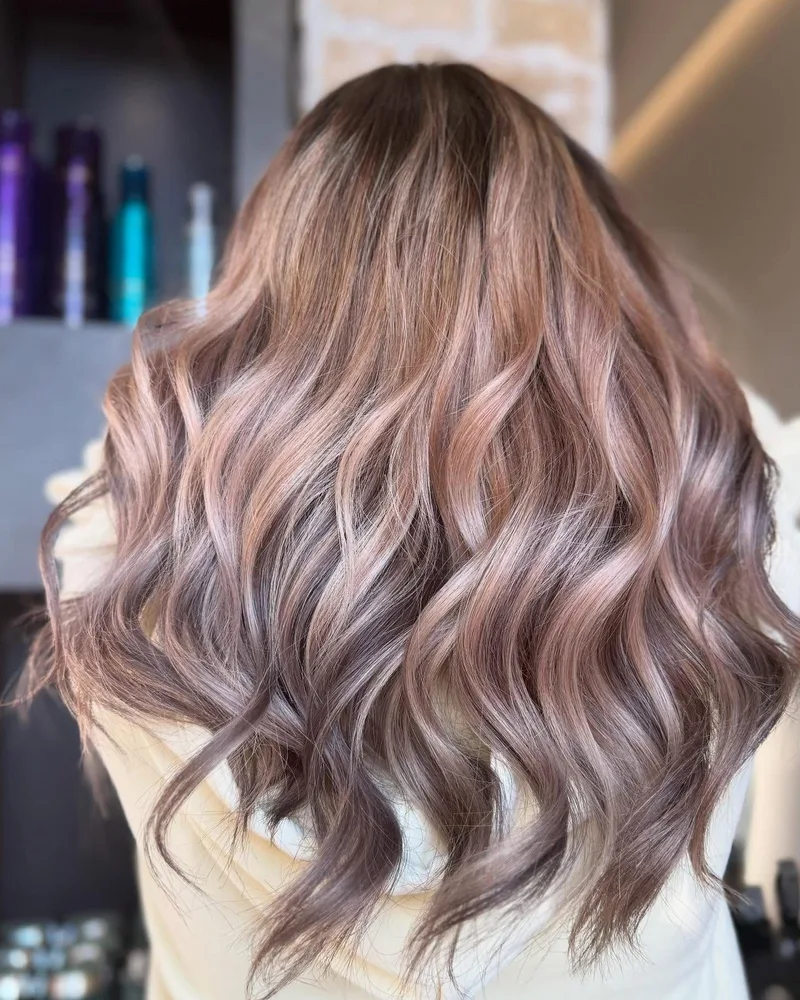 Wavy rose-gold balayage hair color